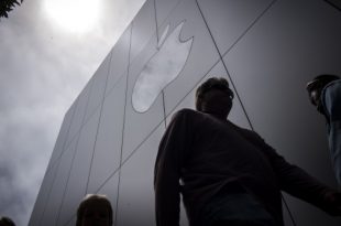 pedestrians walk past an apple inc store in san francisco california u s on thursday august 2 2018 apple inc shares climbed 3 percent on thursday pushing it above 1 trillion in market capitalizati 310x205 - اتهام کمپانی اپل به جاسوسی علیه یکی از مدیران